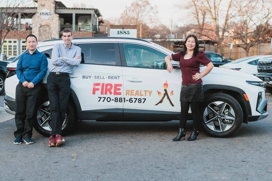 The Fire Realty team with the Fire Realty car